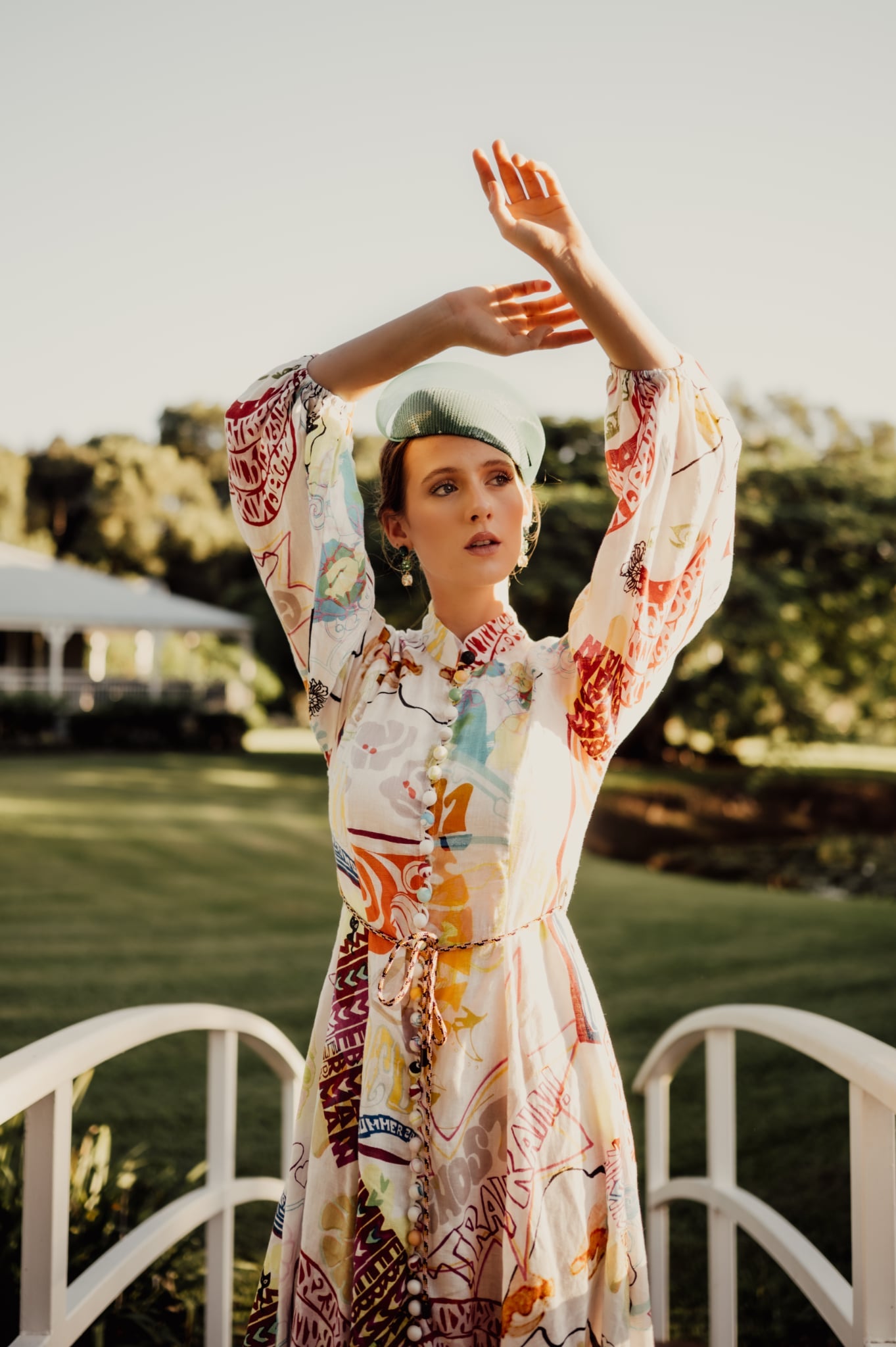 model wearing green sequin headpiece fascinator millinery