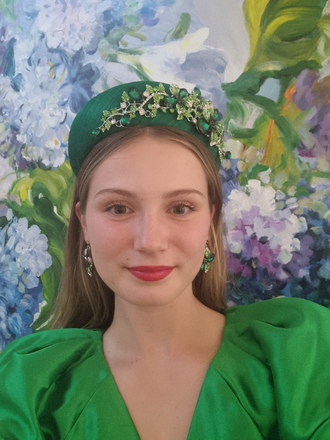 model wearing green silk rhinestone headpiece fascinator millinery