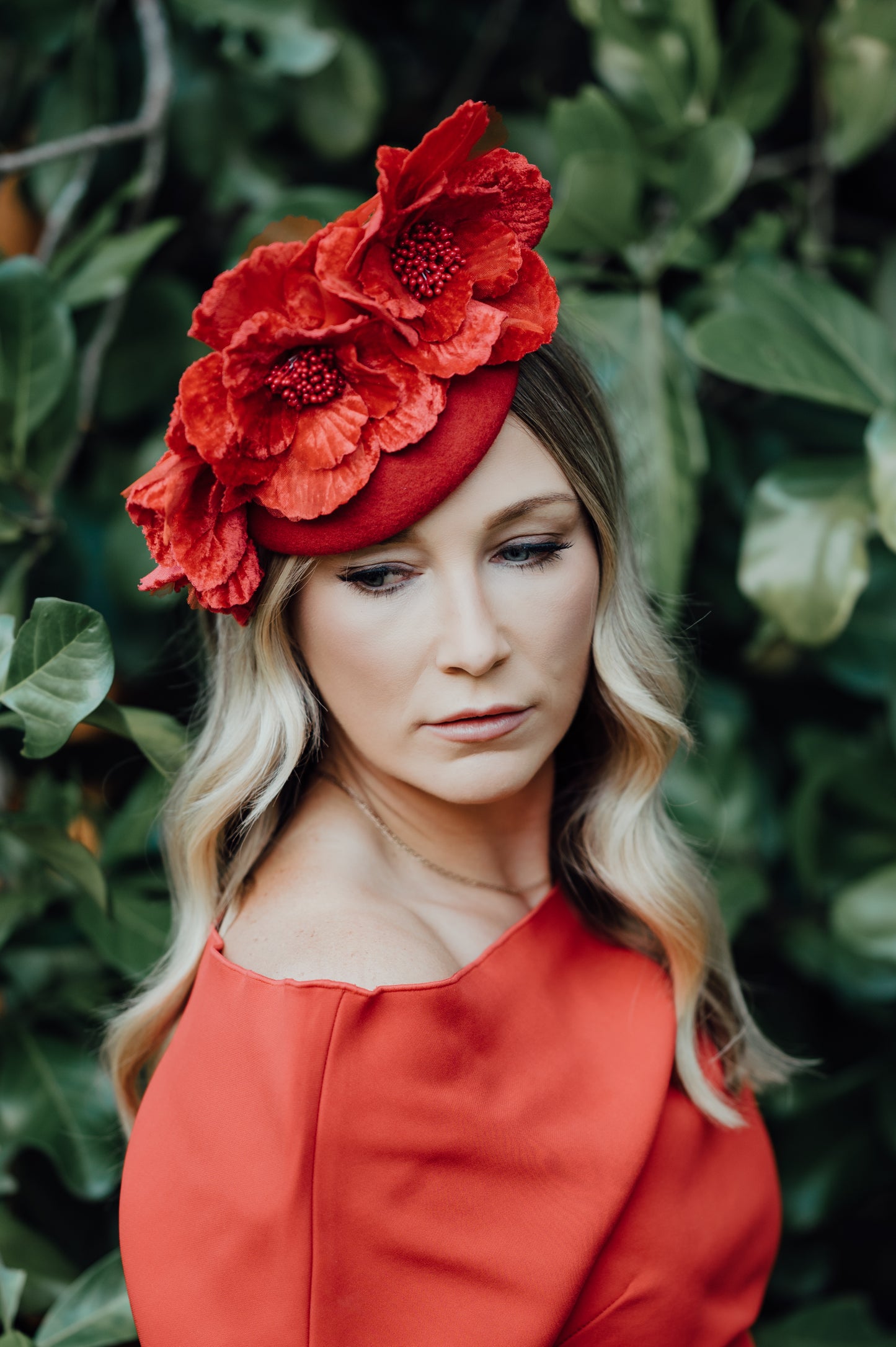 model wearing floral headpiece in a garden