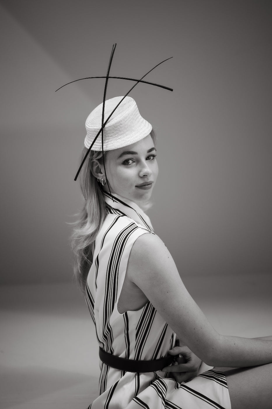 model wearing black and white headpiece