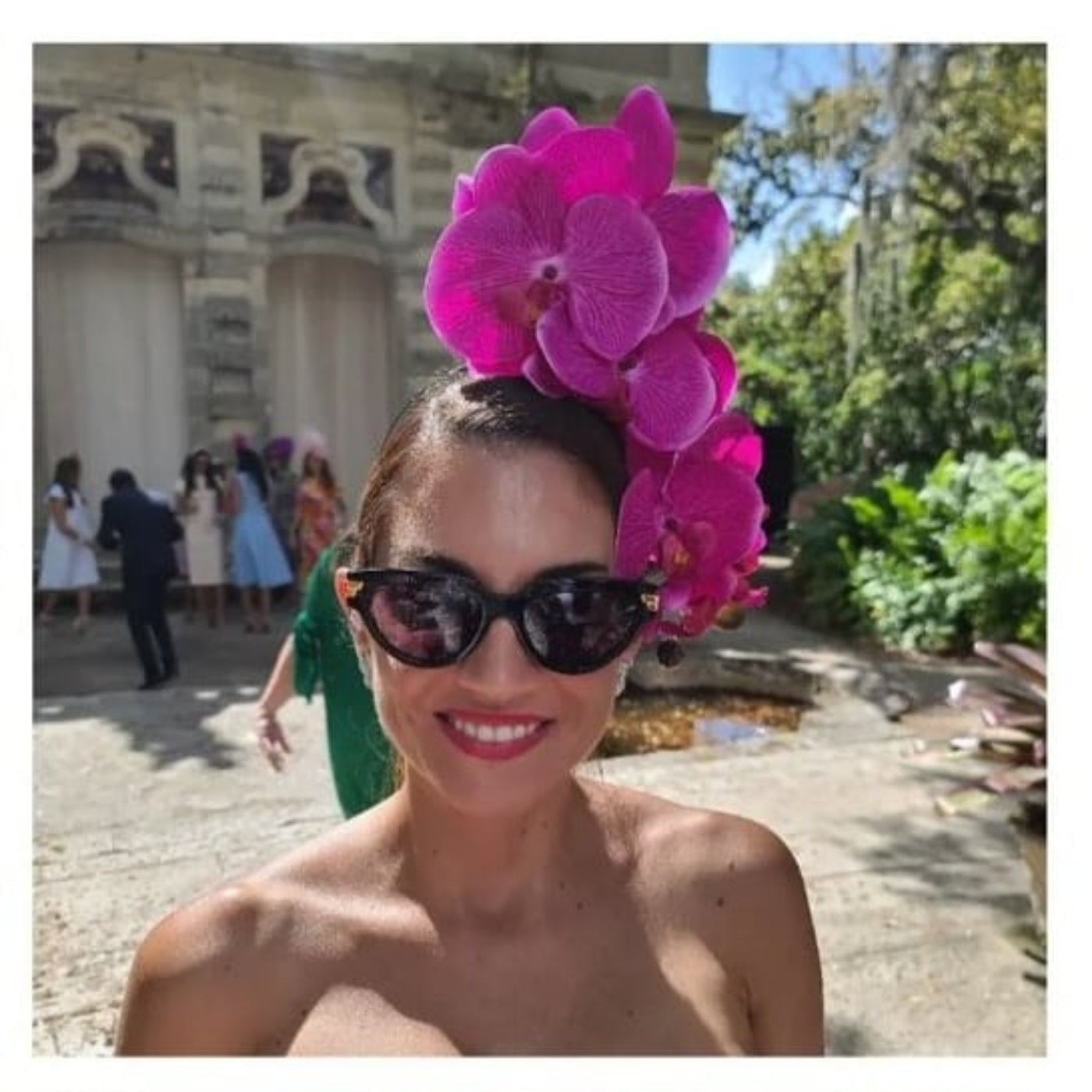 model wearing orchid headpiece