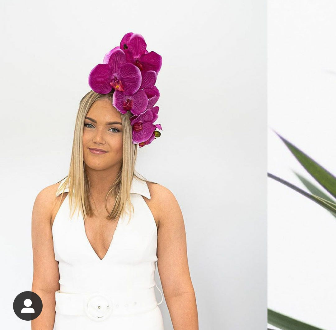 model wearing orchid headpiece