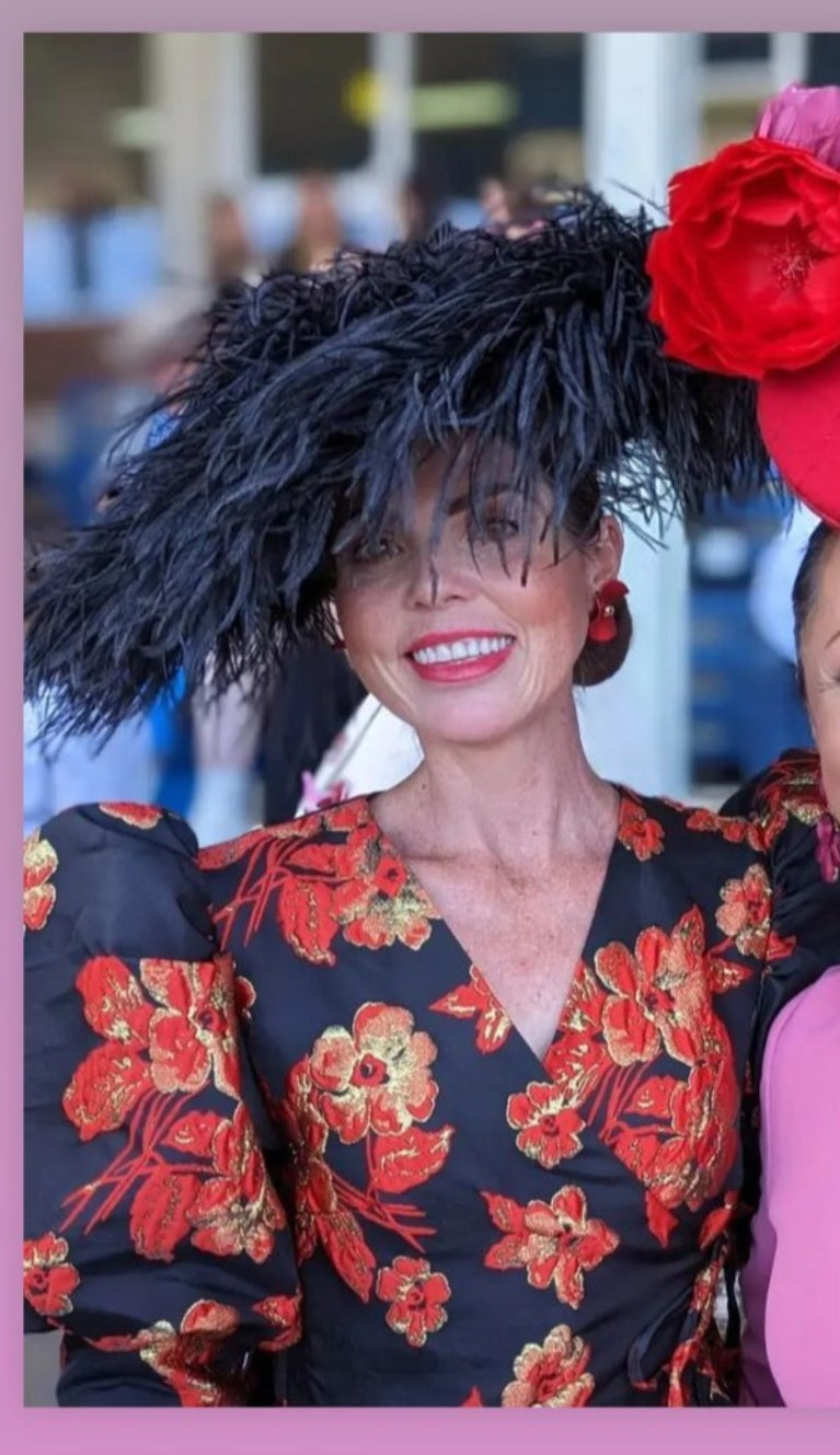 model wearing ostrich feather hat