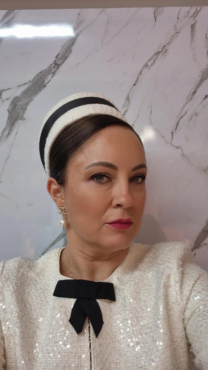 model wearing pill box headpiece