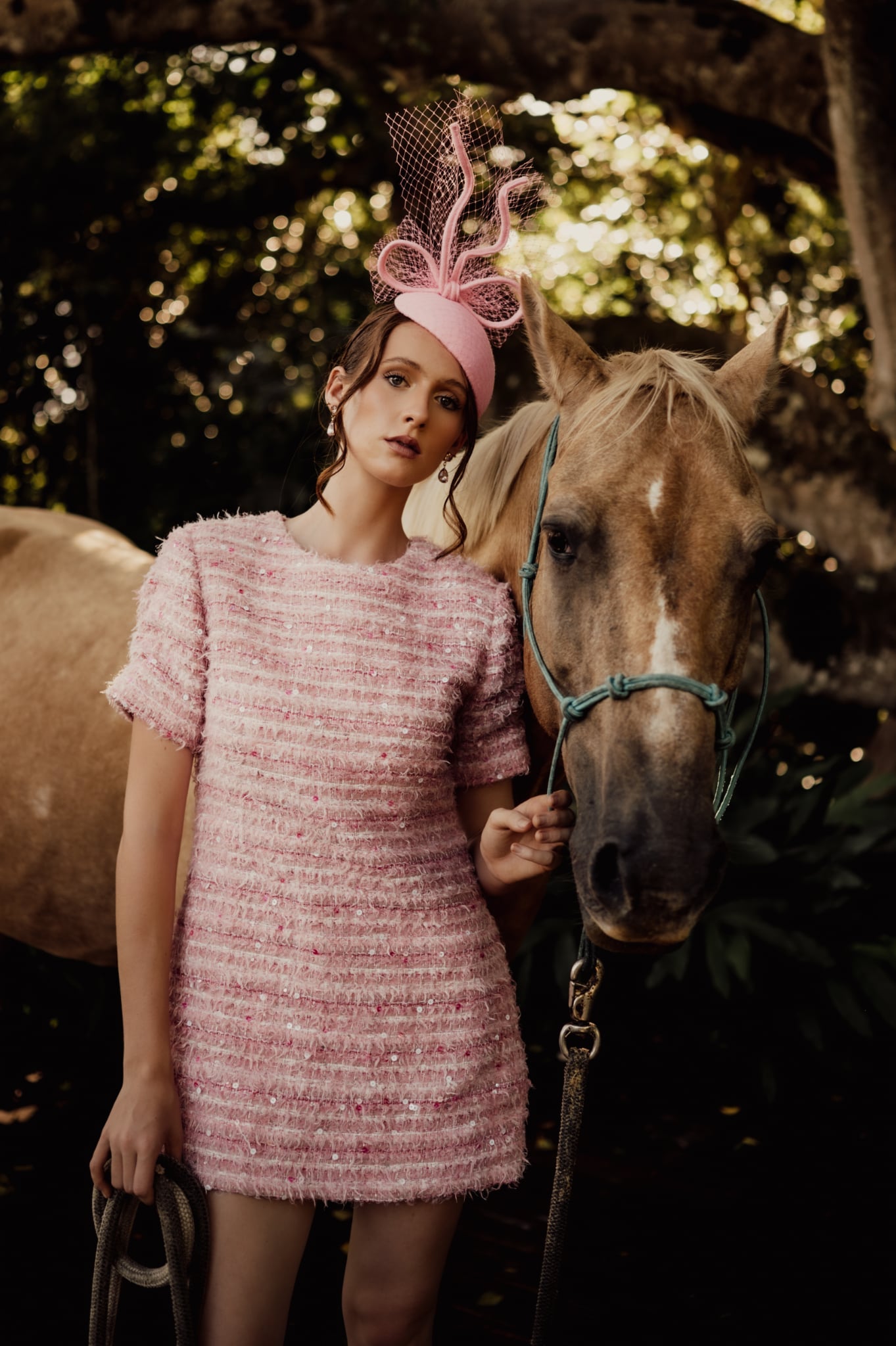 model wearing pink felt headpiece fascinator millinery