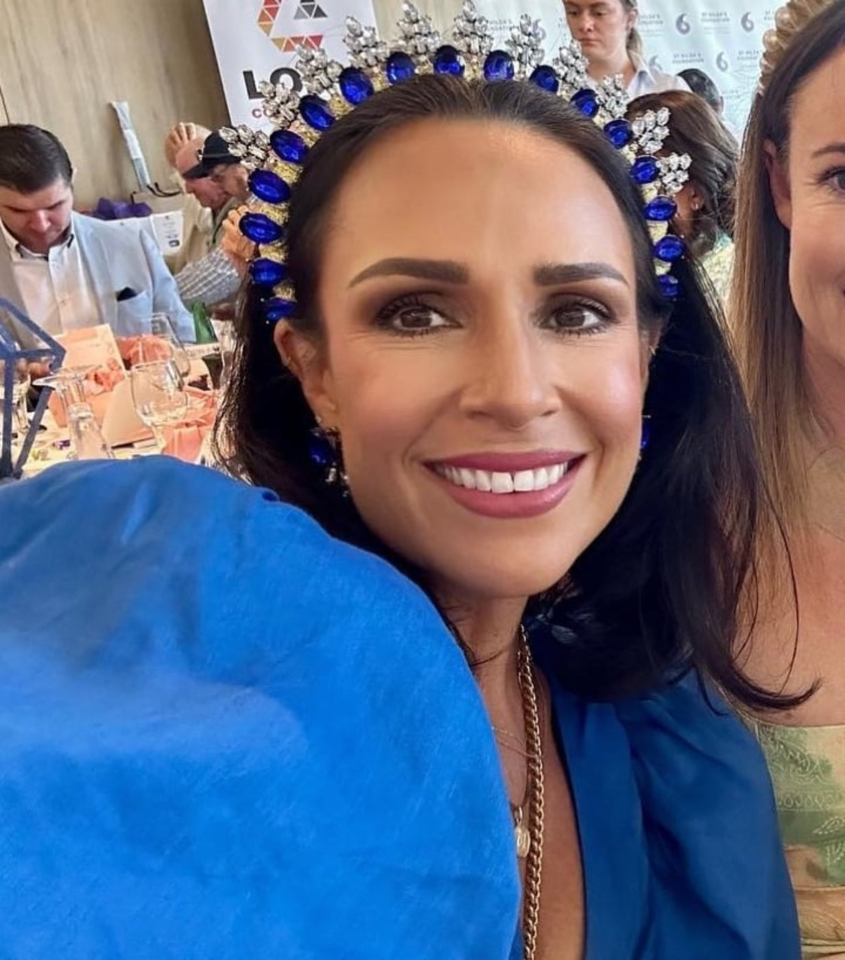 model wearing royal blue rhinestone crown