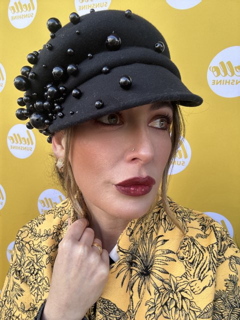 model wearing wool cap in black with pearls