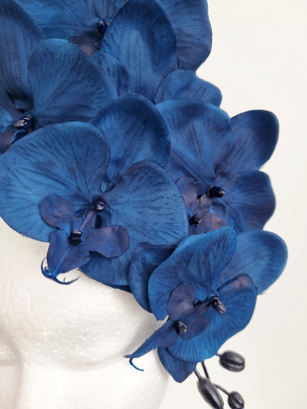 navy blue orchid headpiece close up