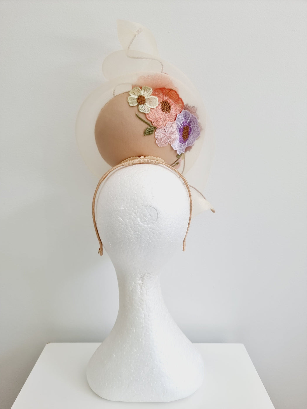 nude floral percher headpiece back