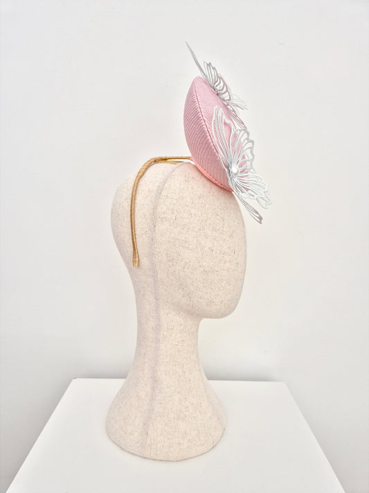 pale pink straw percher with white metal flowers side view