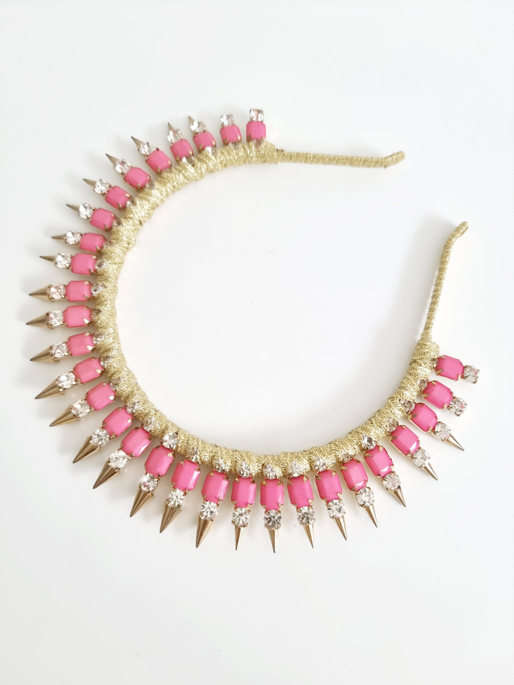 pink and gold metal rivit headband flat lay