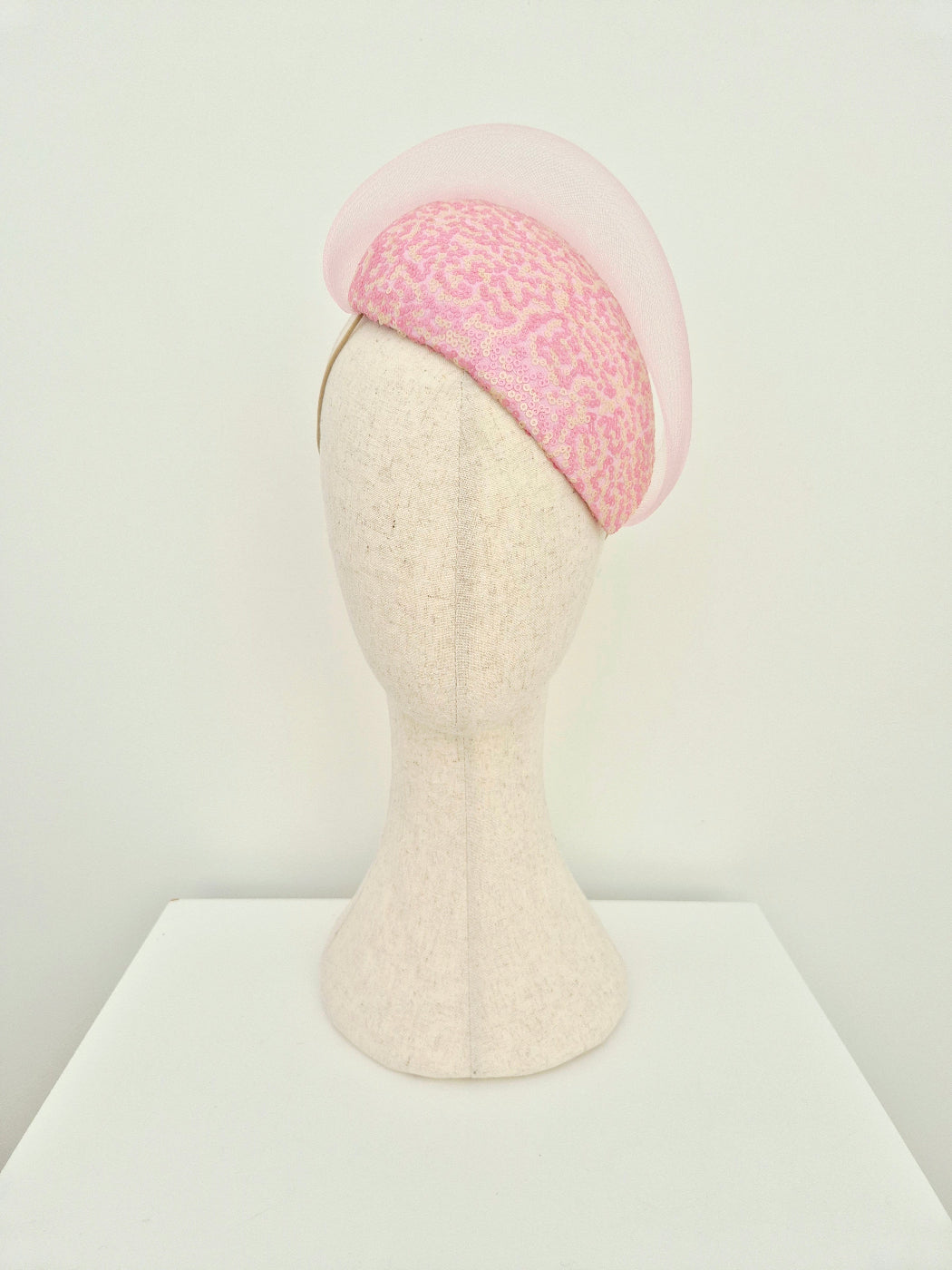 pink and cream sequin headpiece with crinoline wave