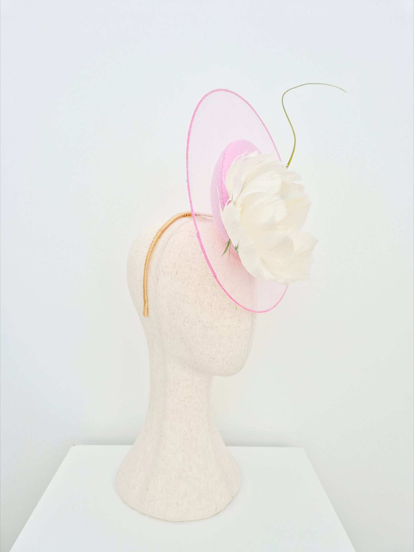 pink percher headpiece with feather flower side view
