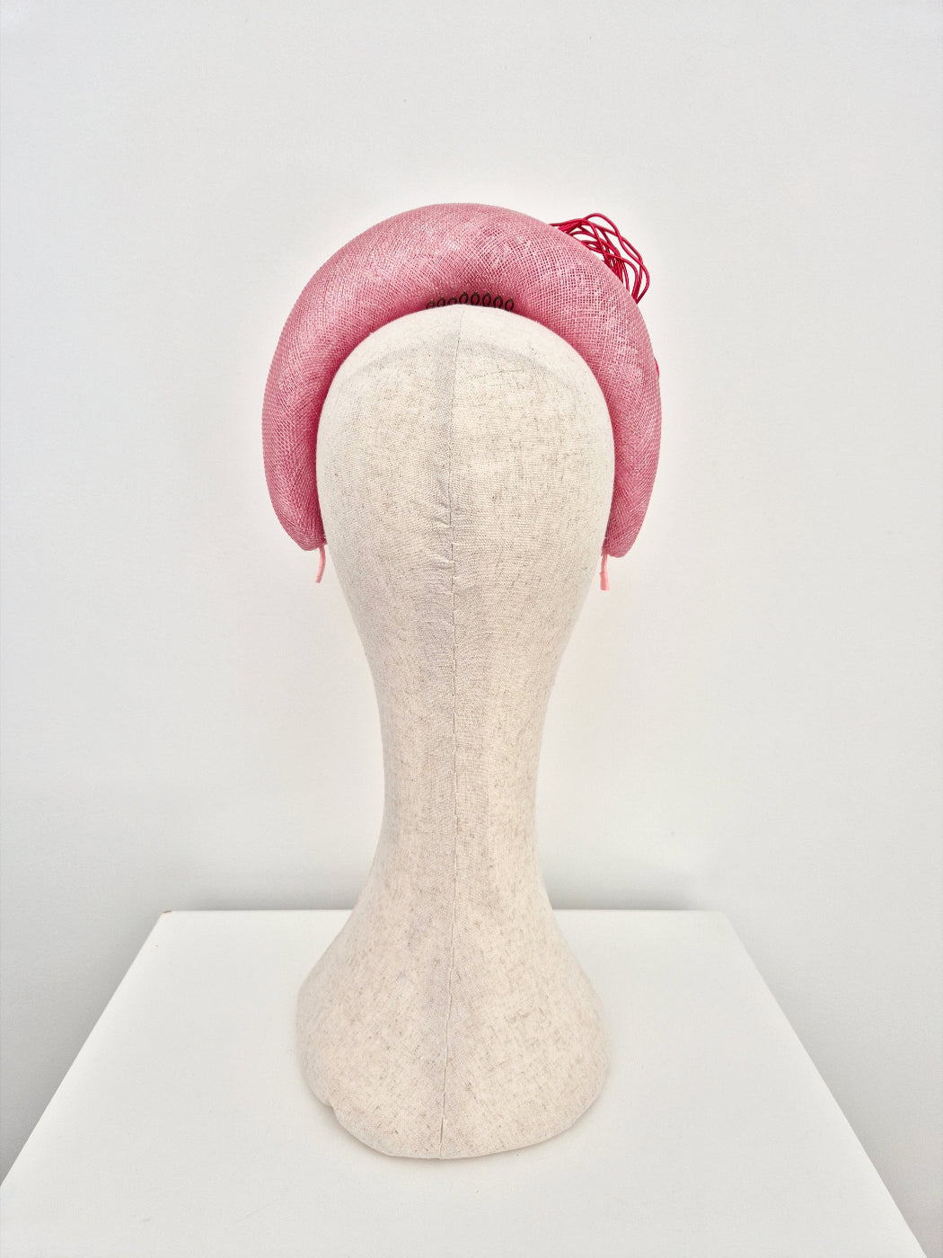 pink straw halo headpiece with red wire roses back view