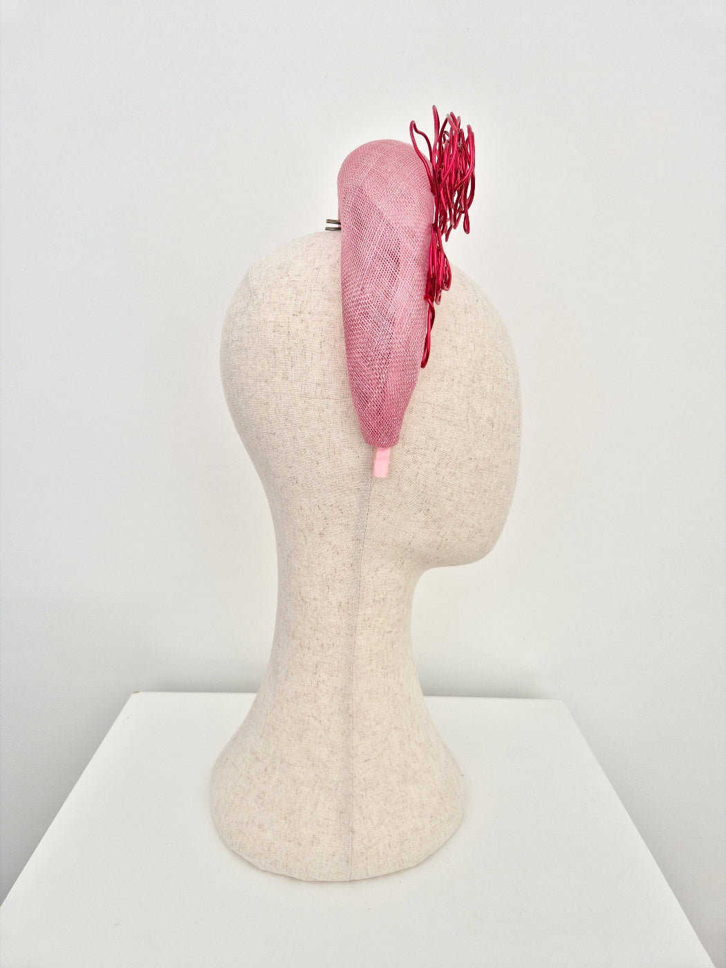 pink straw halo headpiece with red wire roses side view