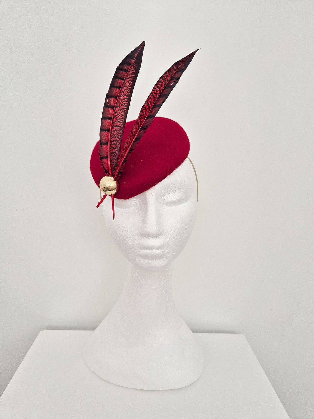 red felt pillbox with feathers front
