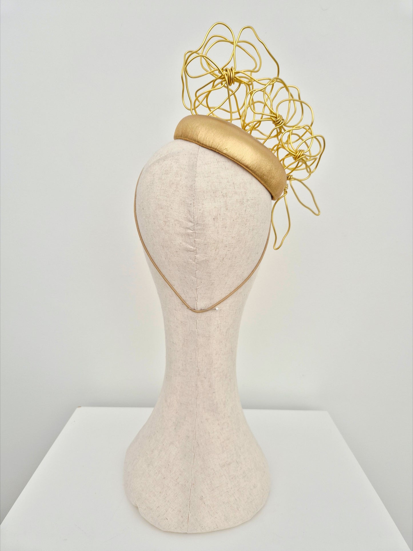 Miss Odessa. Womens Gold leather button headpiece with gold floral wirework