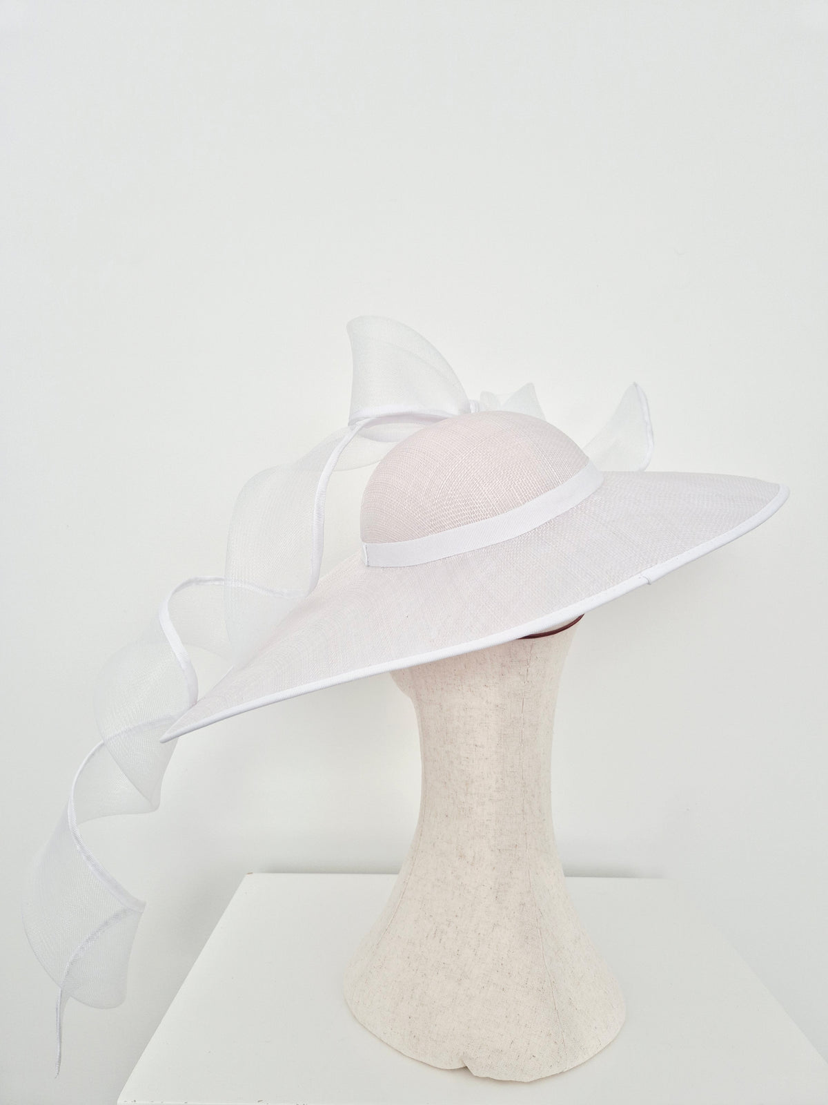 Miss Bonnie. Womens white sinamay straw hat with trailing bow and tails