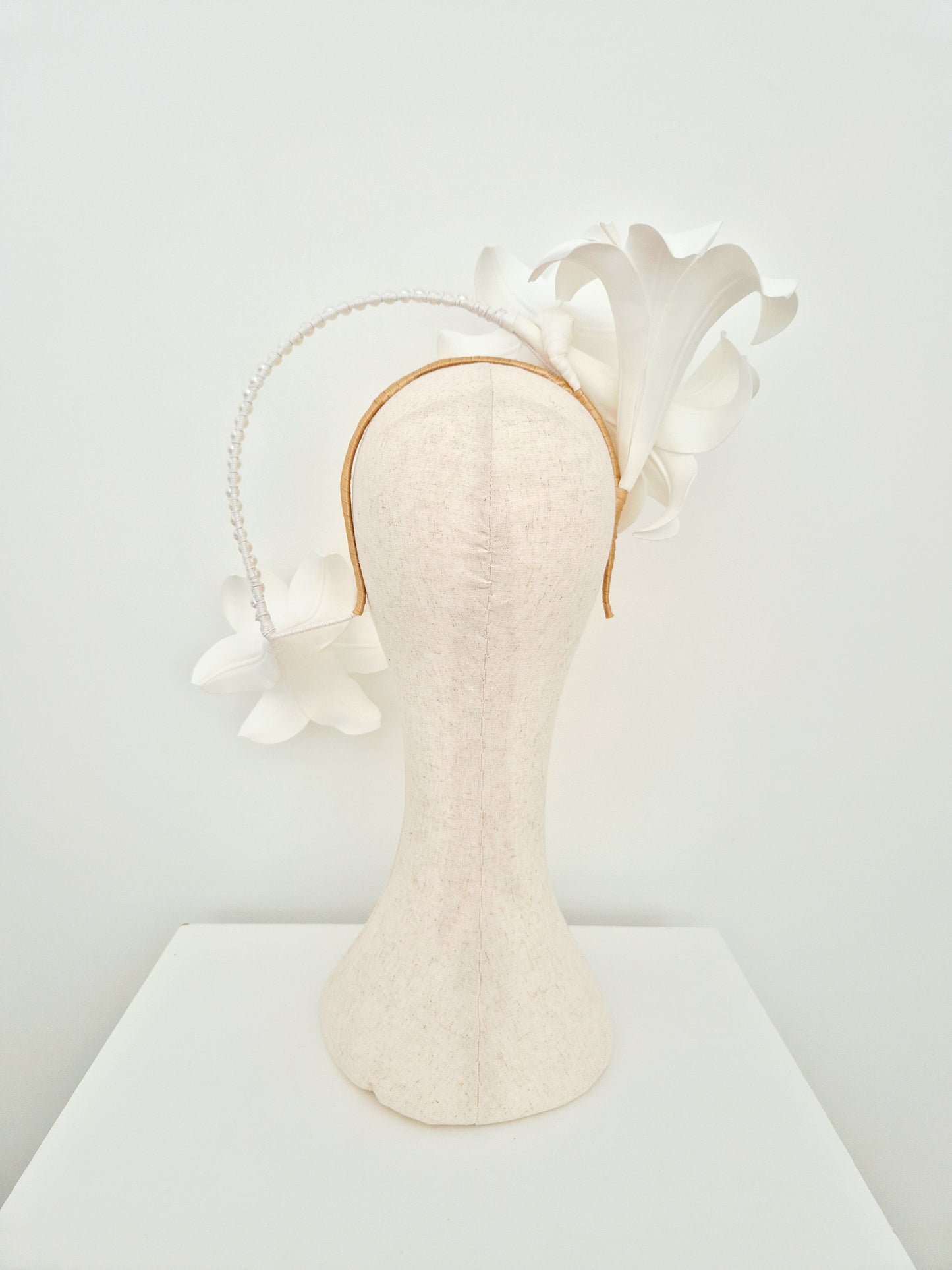 Miss Lilly. Womens white lilly floral cascading headpiece