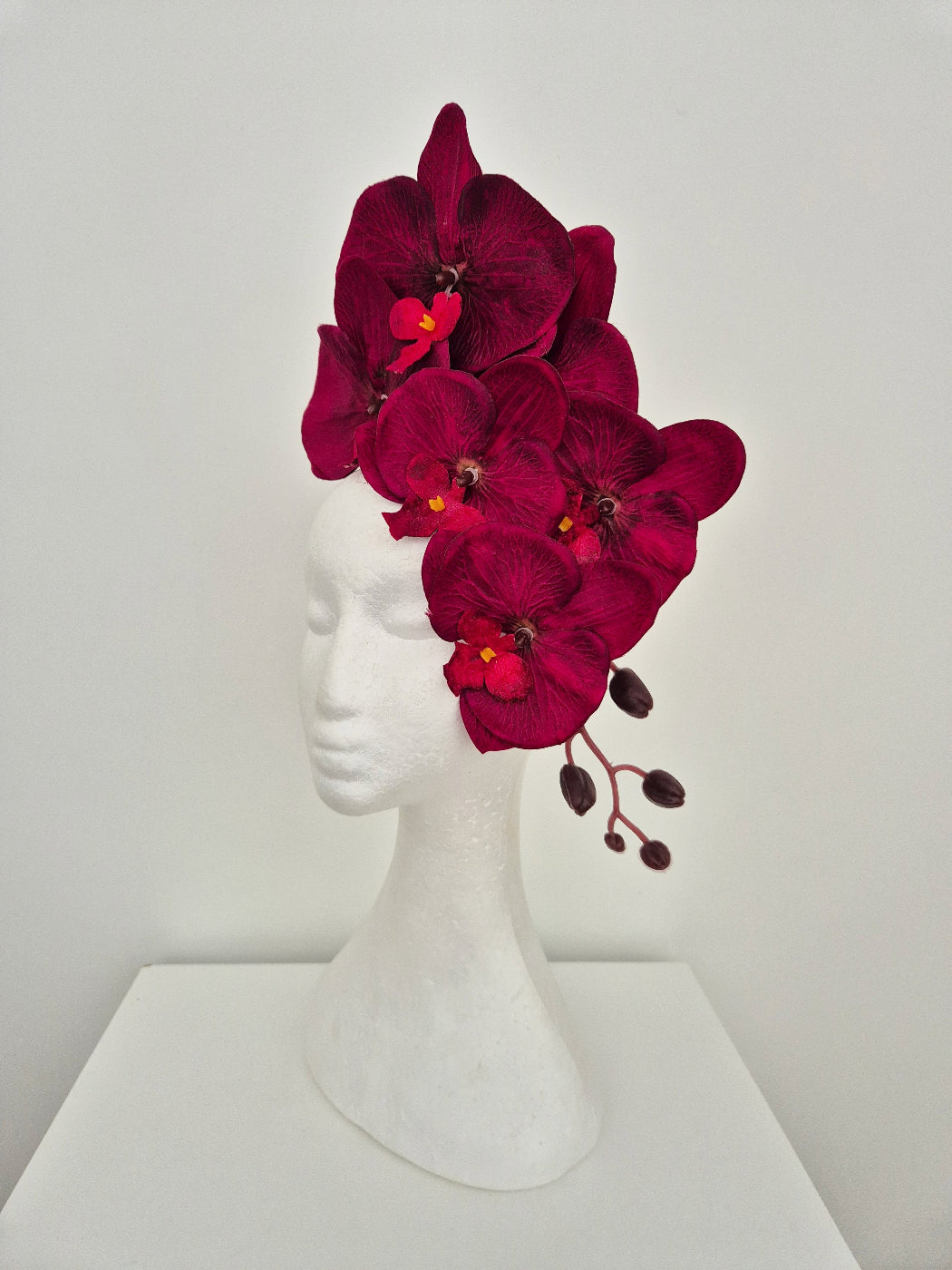 side view of burgundy orchid floral headpiece