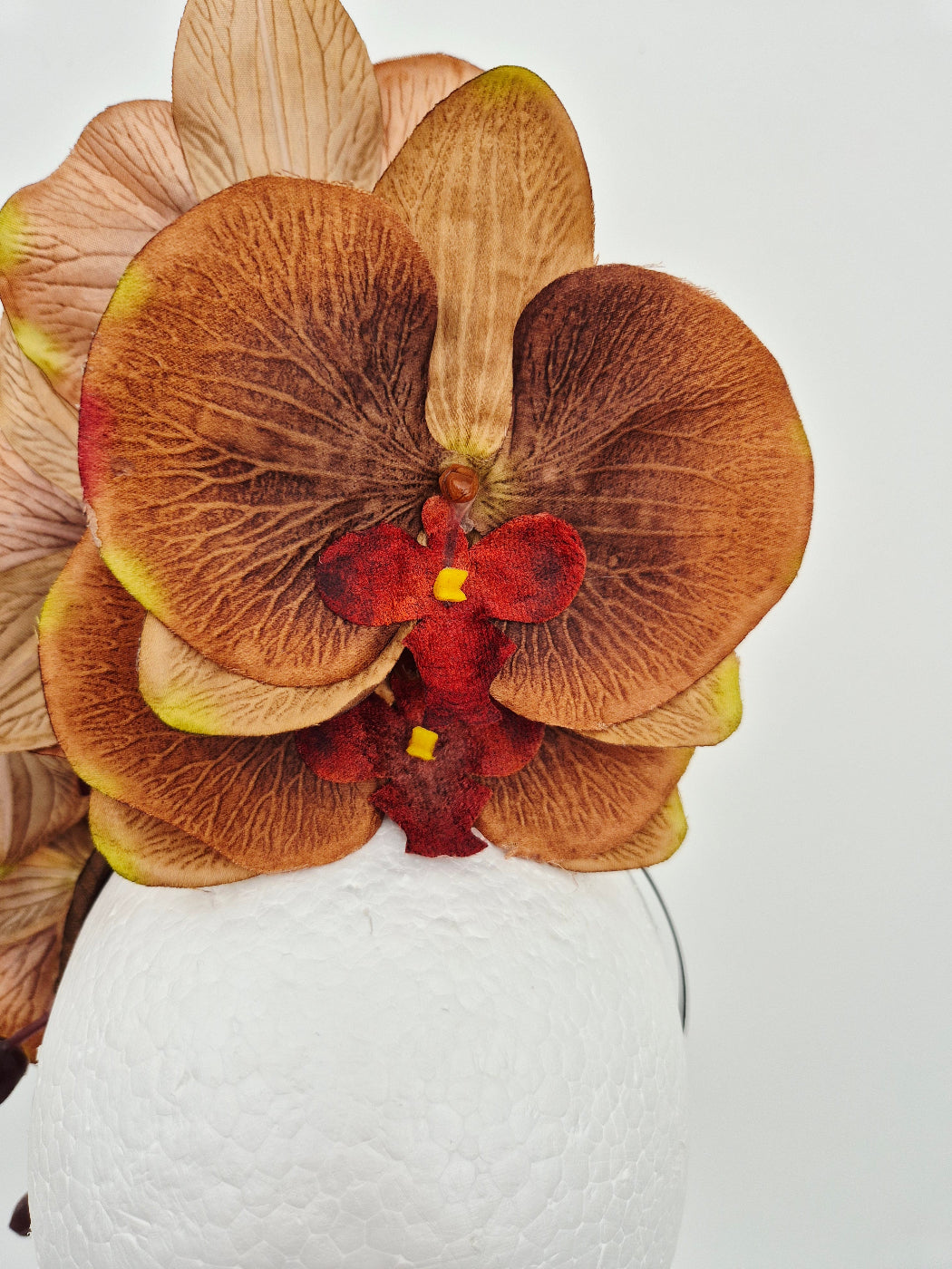 tan brown orchid headpiece close up