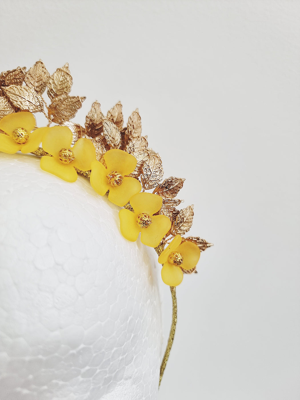 close up yellow and gold floral headband