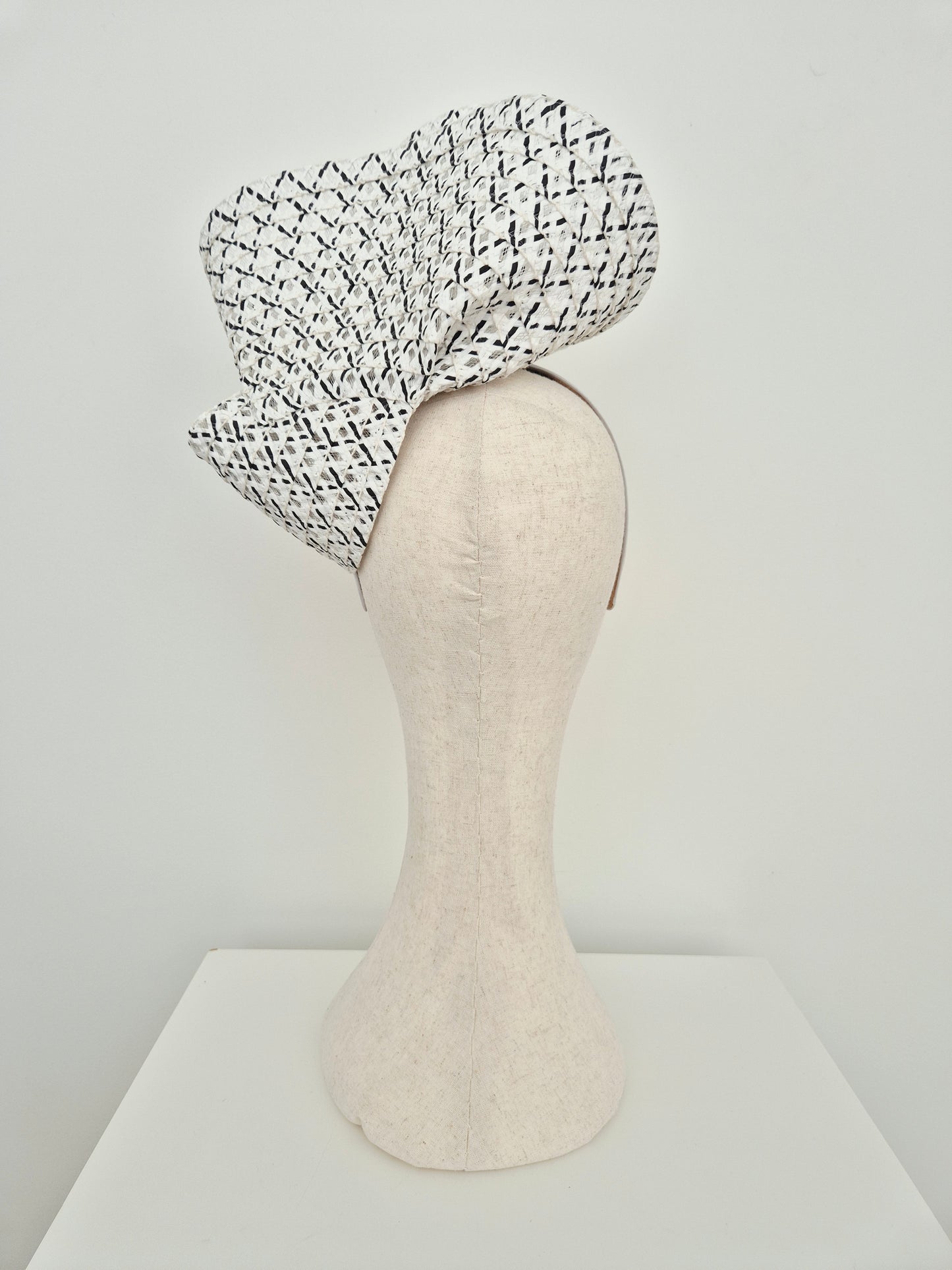 Miss Tara. Womens braided straw headpiece in Black and white