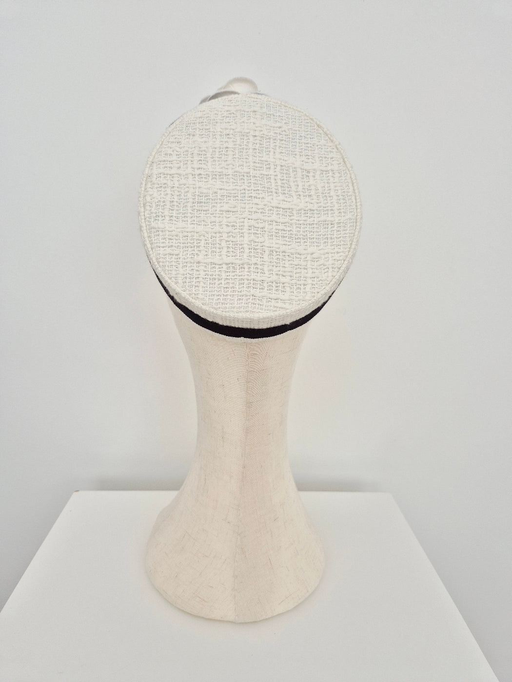 ivory tweed pillbox headpiece back view on a white background