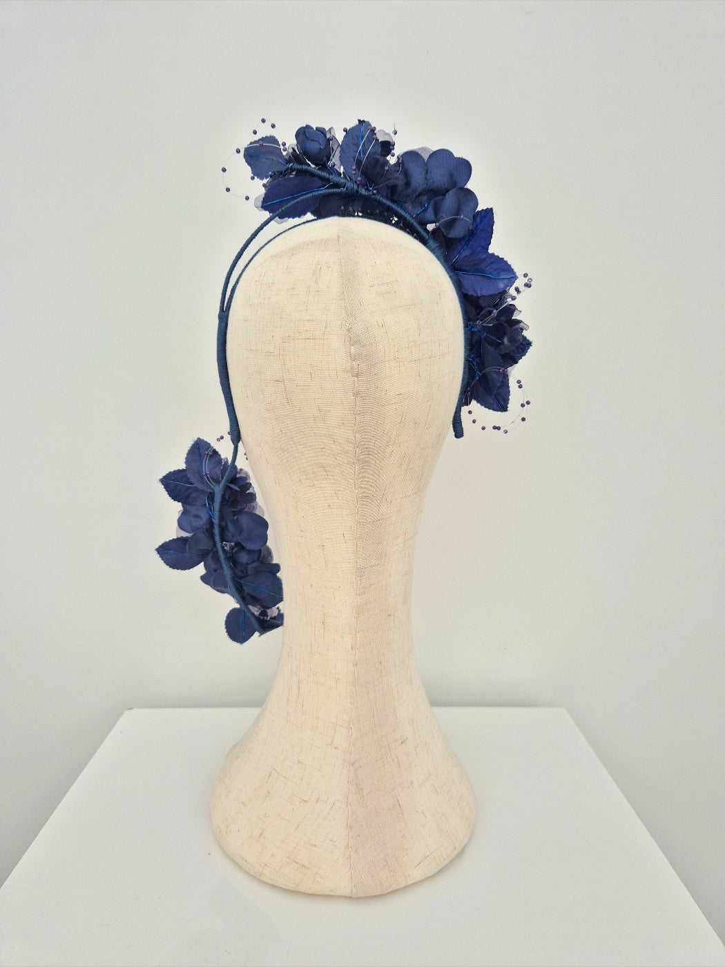 Navy blue floral headpiece back view
