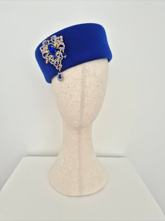 Miss Betty. Womens Royal Blue wool felt pillbox headpiece with rhinestone brooch