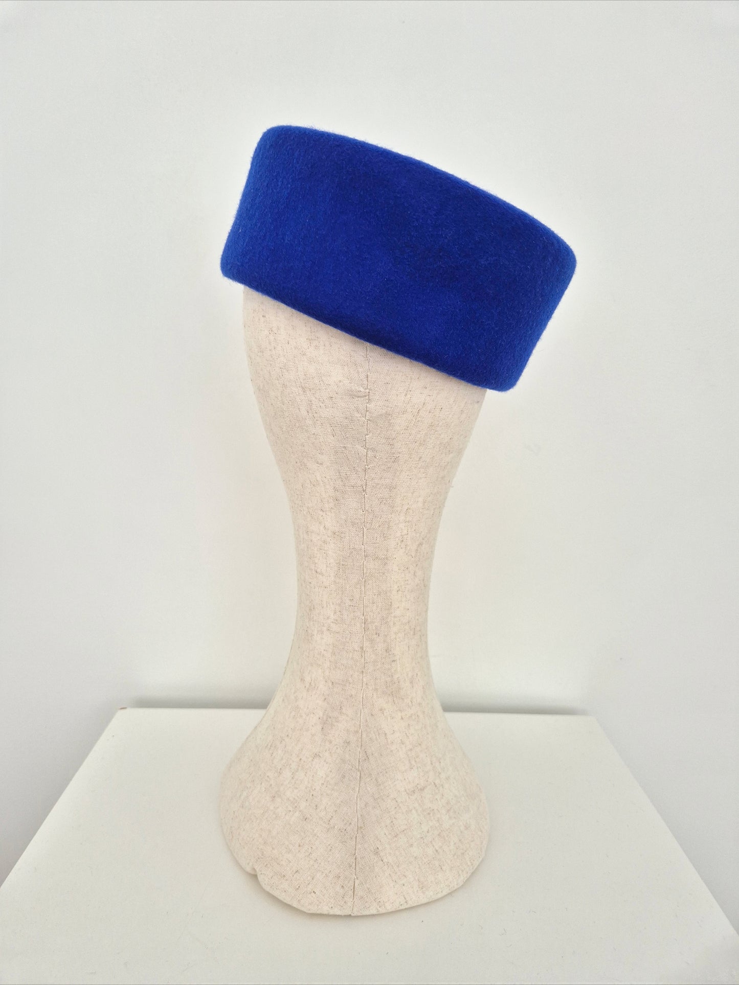 Miss Betty. Womens Royal Blue wool felt pillbox headpiece with rhinestone brooch