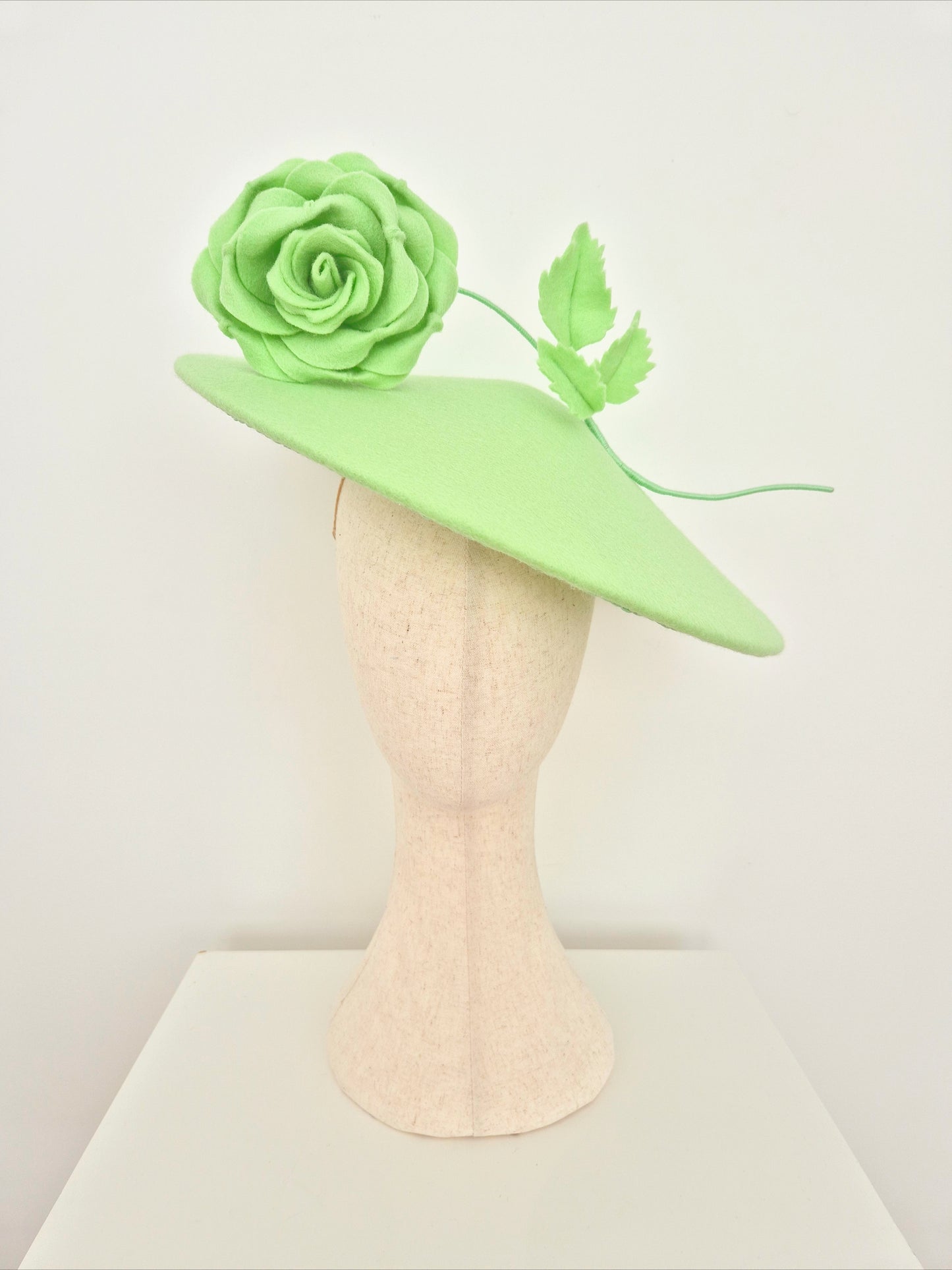 Miss Josephine. Pale mint green wool felt coolie hat with floating rose