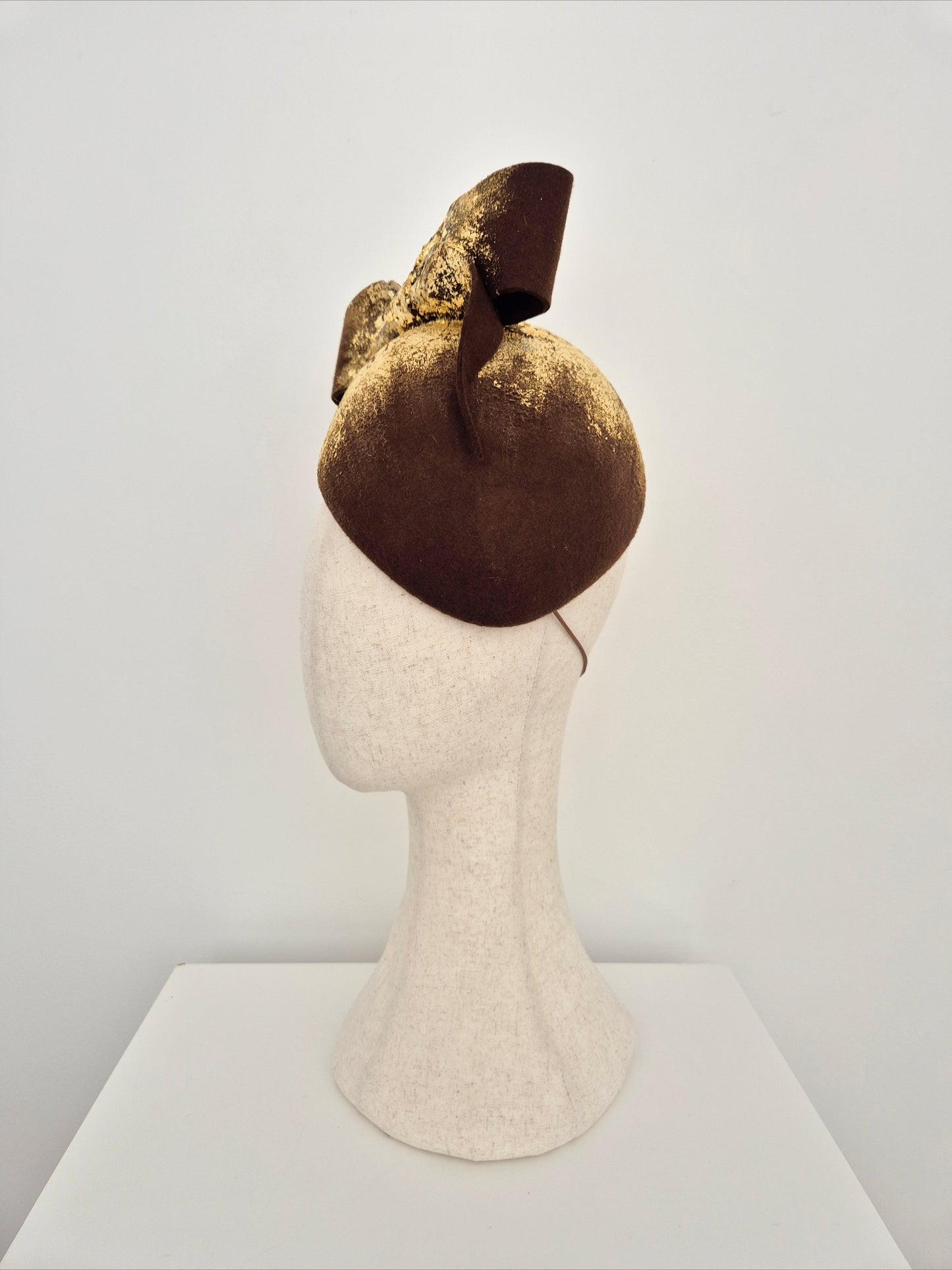 Miss Julia. Womens Chocolate brown felt headpiece with bow and gold foil detail