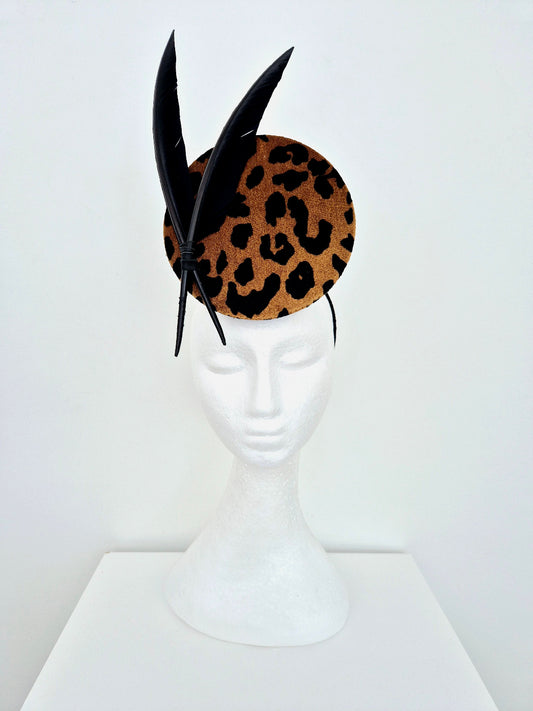 animal print percher with feathers