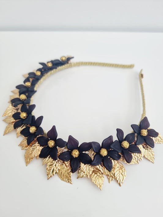 black and gold headband flat lay