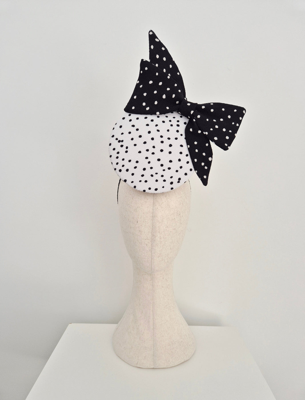 black and white percher headpiece with bow