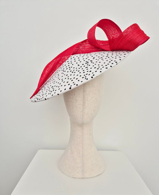 black and white polka dot coolie hat with red sash