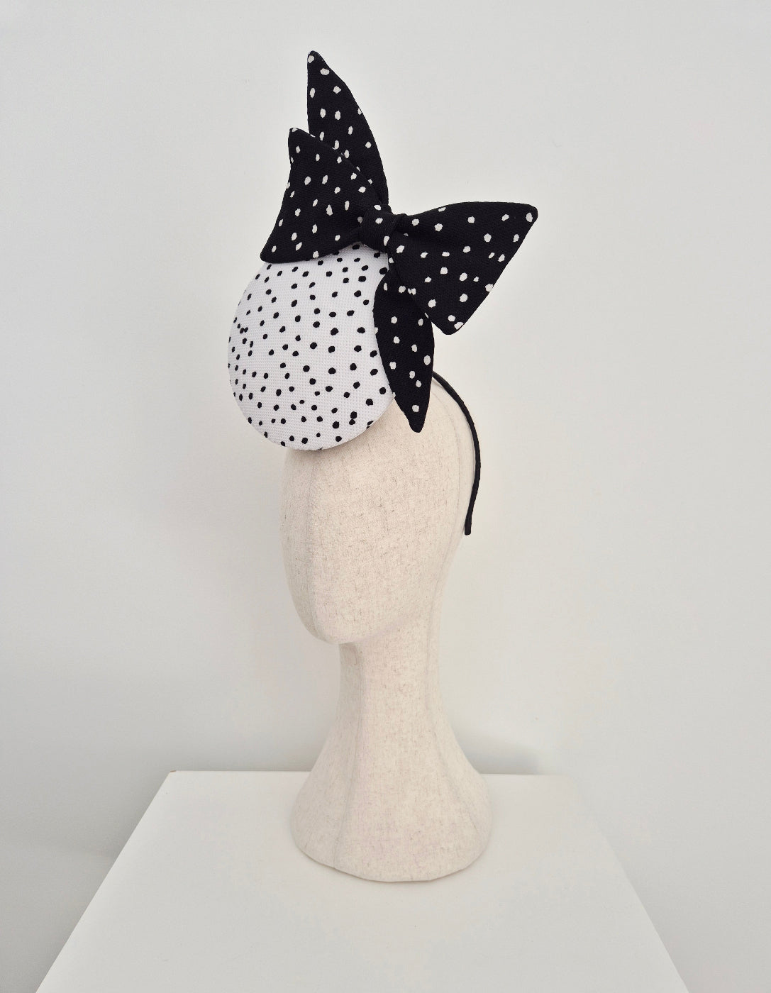 black and white polka dot percher with bow side view