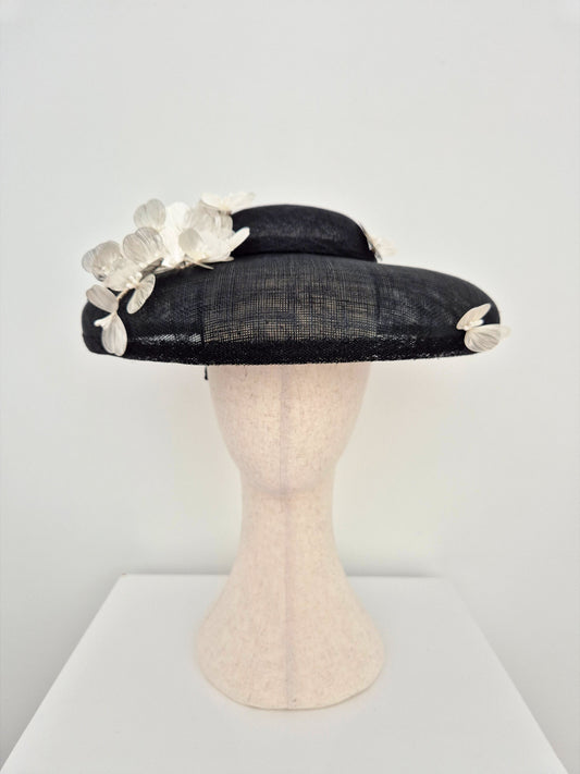 black dior style straw hat with silver white flowers