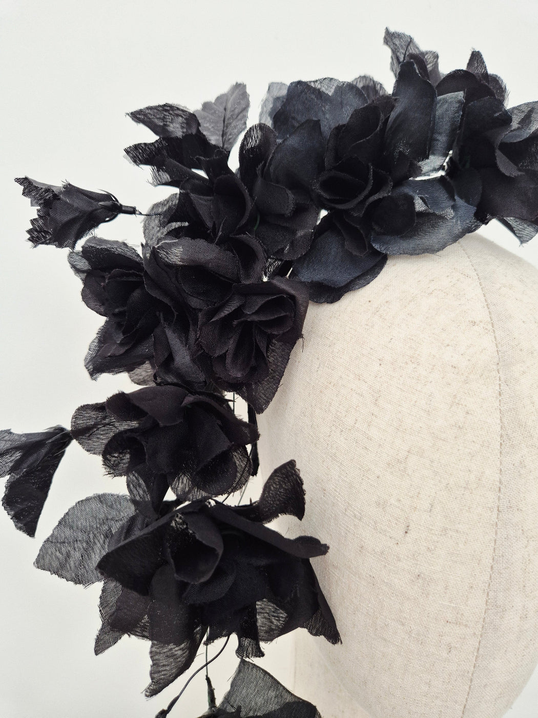 black floral headpiece close up