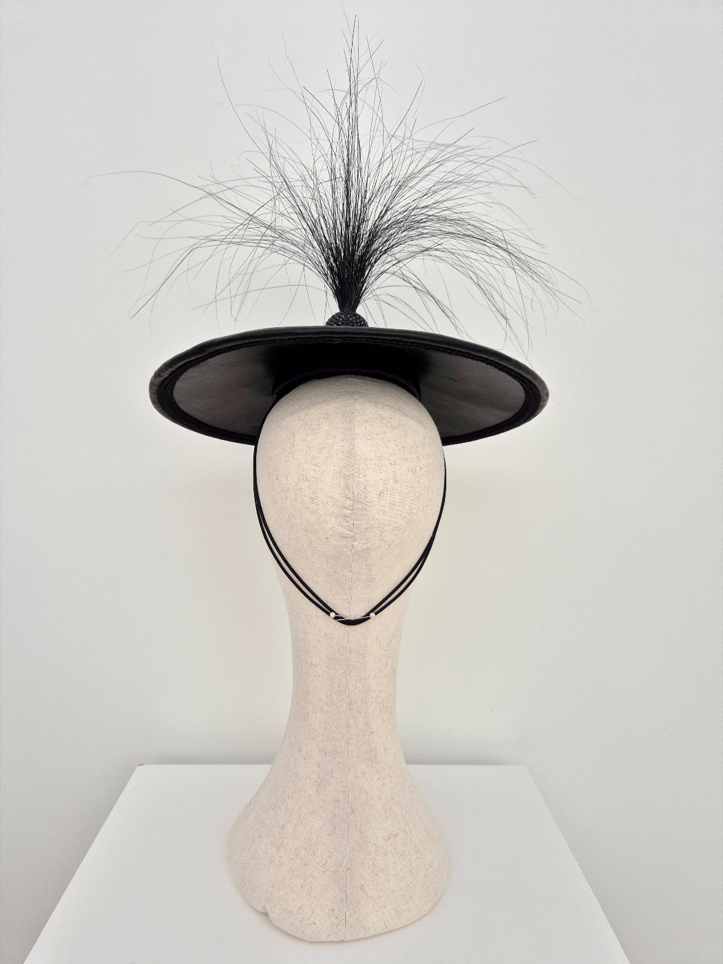 black leather coolie hat with feathers back view