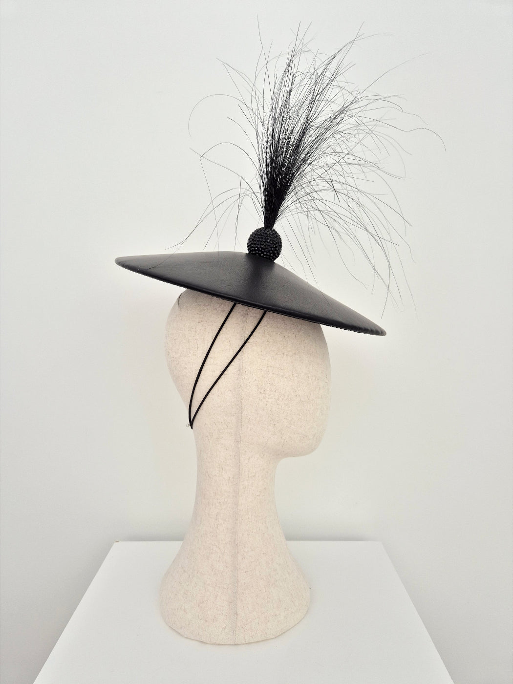black leather coolie hat with feathers side view