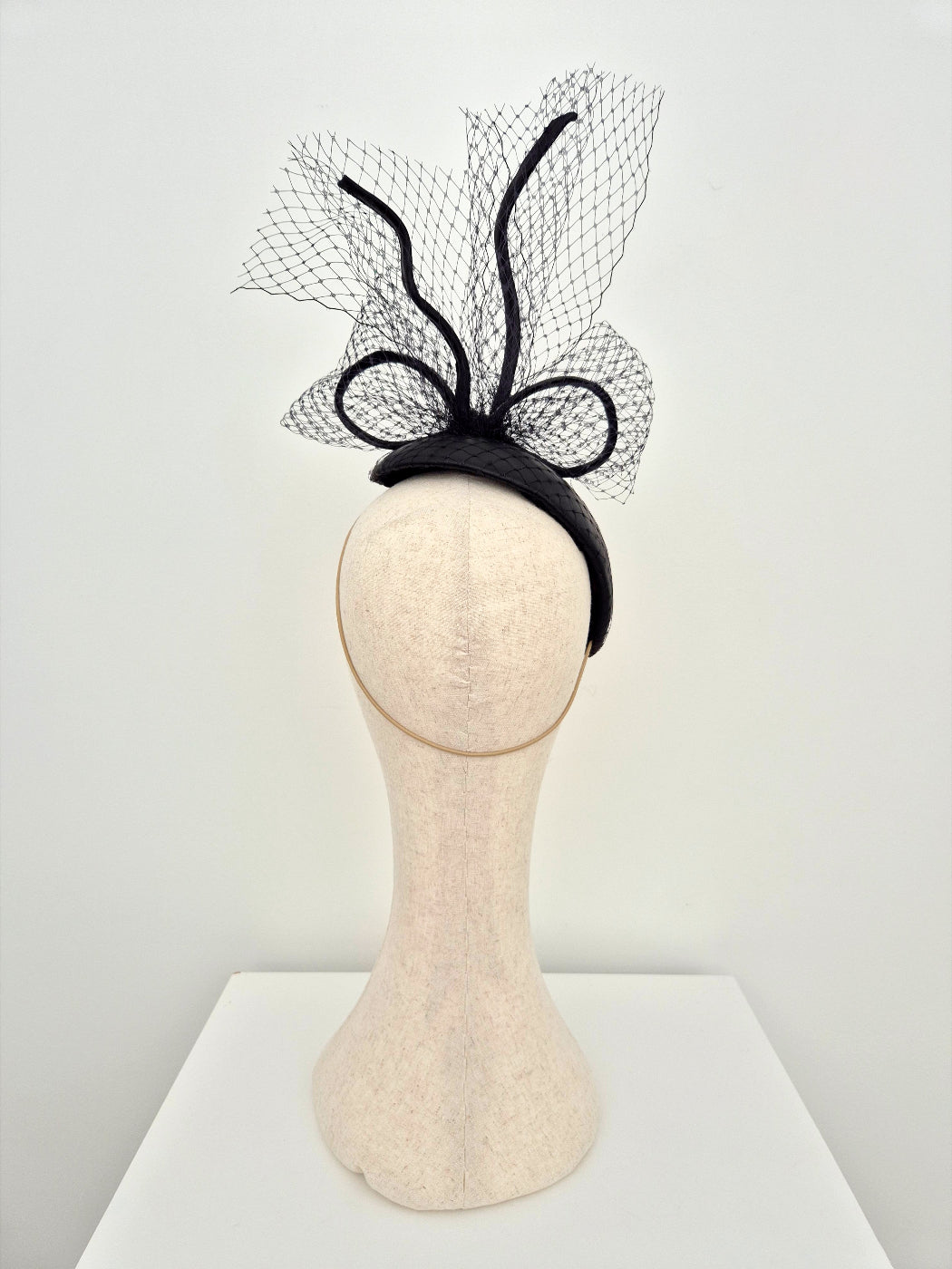 black leather headpiece back view with bow