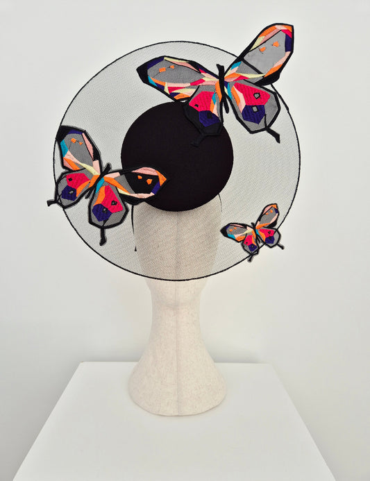 black percher headpiece with butterflies