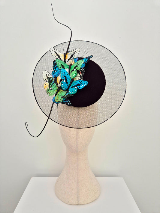 black percher headpiece with feather butterflies