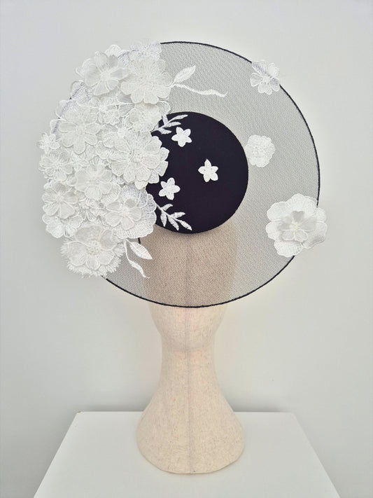 black percher headpiece with white floral lace