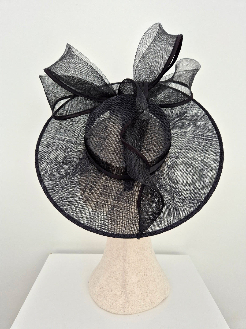 black straw hat with bow top view