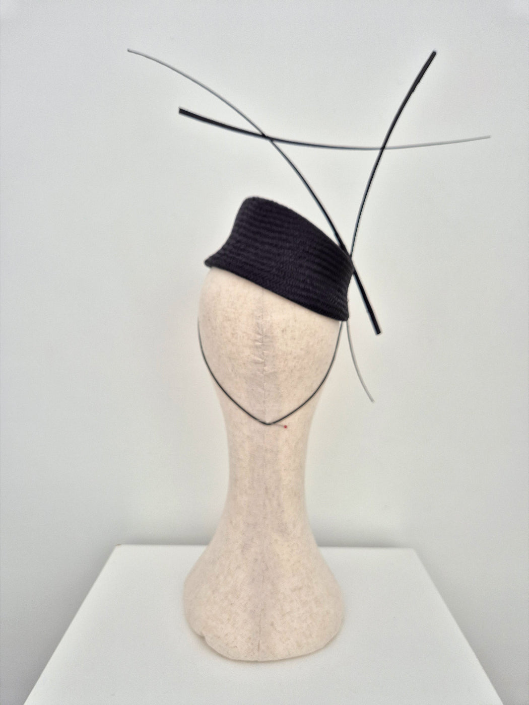 black slanted straw headpiece with quills back view