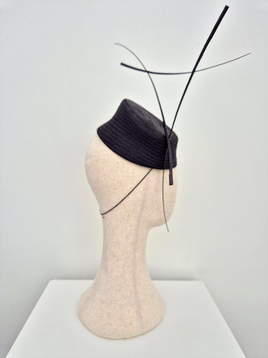 black slanted straw headpiece with quills side view