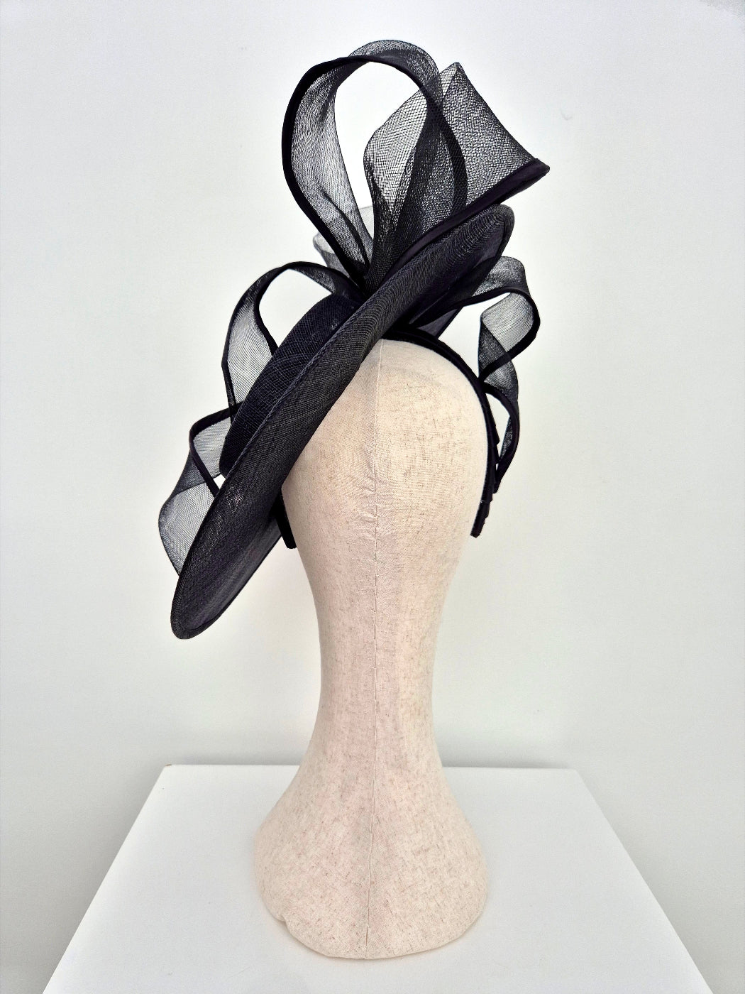 black percher boater hat with bow back view
